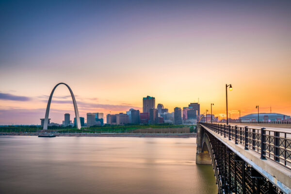 St. Louis, Missouri, USA downtown cityscape on the Mississippi River at twilight. Arch and skyline in St. Louis, Missouri